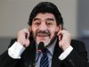 Former Argentine soccer star Maradona gestures during a news conference in Naples