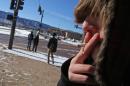 A high school student, who preferred not to be identified, smokes a cigarette in a de facto smoking area just off the property of Lewis-Palmer High School, in Monument, Colo., Thursday Feb. 20, 2014. A proposal to raise the tobacco age to 21 in Colorado is up for its first review in the state Legislature. The bipartisan bill would make Colorado the first with a statewide 21-to-smoke law. (AP Photo/Brennan Linsley)