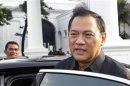 File photo of Indonesian Finance Minister Agus Martowardojo leaving the presidential compound after attending a meeting in Jakarta