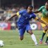 Brazil's Lucas and South Africa's Masenamela fight for the ball during their international friendly soccer match in Sao Paulo