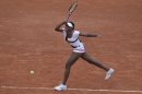 Venus Williams of the U.S. returns in her second round match against Agnieszka Radwanska of Poland at the French Open tennis tournament in Roland Garros stadium in Paris, Wednesday May 30, 2012. (AP Photo/Michel Spingler)