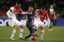 Paris Saint Germain's Marco Verratti of Italy, center, challenges for the ball with Monaco's Emmanuel Riviere of France, left, and Monaco's James Rodriguez of Colombia during their French League One soccer match, in Monaco stadium, Sunday, Feb. 9 , 2014. (AP Photo/Lionel Cironneau)