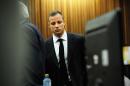 Oscar Pistorius arrives in court in Pretoria, South Africa, Wednesday, March 19, 2014. Pistorius is on trial for the murder of his girlfriend Reeva Steenkamp on Valentine's Day in 2013. (AP Photo/Leon Sadiki, Pool)