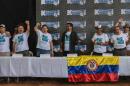 Members of the Revolutionary Armed Forces of Colombia (FARC) celebrate the approval of the peace deal with the government during the closing ceremony of the 10th National Guerrilla Conference in Llanos del Yari, Colombia, on September 23, 2016