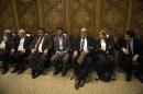 Member of Syrian National Coalition (SNC) Haitham Maleh (3rd-L) sits with a delegation of Syrian dissidents during a meeting of the Arab League Foreign ministers in Cairo on November 3, 2013