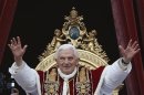 Pope Benedict XVI waves as he blessed the crowd as he makes his "Urbi et Orbi" address from a balcony in St. Peter's Square in Vatican