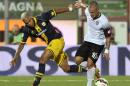 Cesena's Manuel Coppola, right, vies for the ball with Parma's Jonathan Biabiany of France, during their Serie A soccer match at Cesena's Manuzzi stadium, Italy, Sunday, Aug. 31, 2014. (AP Photo/Marco Vasini)