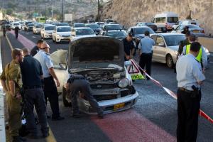 Israeli police inspect the damaged car of a Palestinian &hellip;