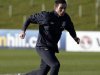 England's Lampard runs with a ball during a training session at the St George's Park training complex near Burton Upon Trent