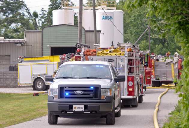 <p> Putnam County officials respond to the scene where several acetylene cylinders exploded at the Airgas facility in Black Betsy, W.Va., Monday afternoon, May 13, 2013. Fire crews were dispatched at about 3:20 p.m. to Airgas, a distributor of specialty gases, said Jason Owens of Putnam County’s emergency management center. He described the injuries to the two as minor and said they were transported to Cabell Huntington Hospital for treatment. A hospital official did not know their conditions. (AP Photo/Daily Mail, Bob Wojcieszak)