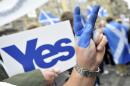 A supporter of Scottish independence on September 21, 2013 flashes the victory sign at a rally in Edinburgh
