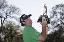 Steven Bowditch, of Australia, poses with his trophy after winning the Texas Open golf tournament on Sunday, March 30, 2014, in San Antonio. (AP Photo/Eric Gay)