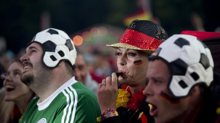 German soccer fans watch their team during the Match Germany vs Ghana in a public viewing zone in Berlin