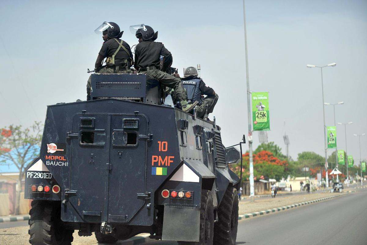 File picture taken on April 18, 2011 shows Nigerian police enforcing a curfew in Bauchi city, the capital of Bauchi state, northern Nigeria, following riots led by Muslim youths