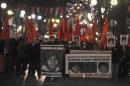 Anti-government protesters march as they carry portraits of Berkin Elvan