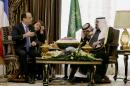 Saudi Arabia's King Abdullah, right, speaks with French President Francois Hollande during their meeting in Riyadh, Saudi Arabia, Sunday, Dec. 29, 2013. Increasingly vocal in its frustration over United States policies in the Mideast, Saudi Arabia is strengthening ties elsewhere, seeking out an alignment that will bolster its position after it was pushed to the sidelines this year. (AP Photo/Kenzo Tribouillard, Pool)