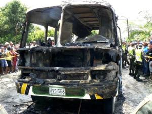 The charred remains of a bus, in which children died in, is seen in Fundacion