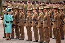Britain's Queen Elizabeth II inspects the Queen's Gurkha Engineers Attestation Party during her visit to Invicta Park Barracks, in Maidstone on February 24, 2011