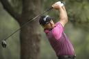 Graeme McDowell, of Northern Ireland, watches his tee shot on the second hole during the first round of the U.S. Open golf tournament in Pinehurst, N.C., Thursday, June 12, 2014. (AP Photo/Chuck Burton)