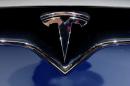 A Tesla logo is seen on media day at the Paris auto show, in Paris