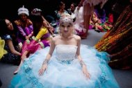 Miss World contestant Evgeniya Klishina, of Kazakhstan, waits backstage prior to a rehearsal for the final ceremony at the Ordos Stadium Arena in inner Mongolia on August 17. Reigning Miss World Ivian Sarcos of Venezuela handed over her crown to the Chinese winner in the futuristic Ordos stadium, which sits alongside a vast town square dedicated to the mighty Mongolian warrior Genghis Khan. (AFP Photo/Ed Jones)