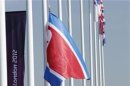 The flag of North Korea is raised during a welcoming ceremony in the Athletes Village at the Olympic Park ahead of the London 2012 Olympic Games