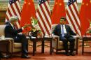 U.S. Secretary of State John Kerry meets with China's President Xi Jinping, right, at the Great Hall of the People in Beijing Thursday, July 10, 2014. (AP Photo/Jim Bourg, Pool)