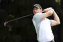 Rory Mcilroy, of Northern Ireland, hits from the tee on the third hole during the second round of play in the Tour Championship golf tournament Friday, Sept. 12, 2014, in Atlanta. (AP Photo/John Amis)