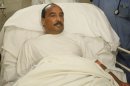 File - In this Sunday, Oct. 14, 2012, handout file photo released by the Mauritanian government news agency AMI (Agence Mauritanienne de l'Information), Mauritanian President Mohamed Ould Abdel Aziz recovers at the Ksar Military Hospital in Noukchott, Mauritania before being evacuated to France for further treatment for a gunshot wound sustained to the arm. Mauritania's Minister of Communication says President Mohamed Ould Abdel Aziz has been lightly wounded by friendly fire after his vehicle was fired upon by the military on the outskirts of the capital, Nouakchott. Thousands of Mauritanians lined the street from the airport to welcome back President Mohamed Ould Abdel Aziz, who went to France for five weeks of medical treatment after being accidentally shot in a friendly fire incident. His return Saturday Nov 24 2012, puts an end to speculation over the state of his health, as well as over the future of Mauritania.(AP Photo/Agence Mauritanienne de l'Information, file)