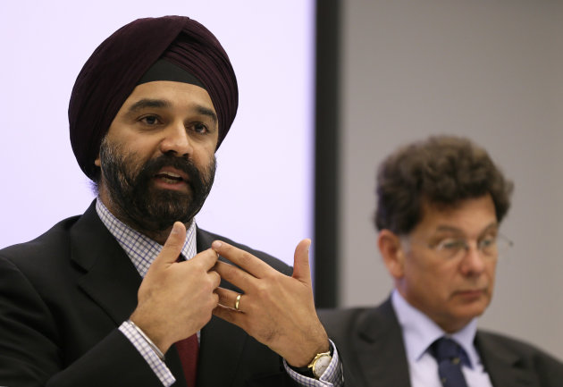 Dr. Harpal Kumar, Chief Executive of Cancer Research UK, left, speaks at a news conference about breast cancer screening in London, Monday, Oct. 29, 2012. Breast cancer screening for women over 50 saves lives, an expert panel was commissioned by Cancer Research U.K. has concluded, confirming findings in U.S. and other studies. (AP Photo/Kirsty Wigglesworth)