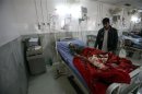 Badly injured Pakistani paramilitary soldier, who survived a shooting by Taliban militants, receives treatment at a hospital in Peshawar