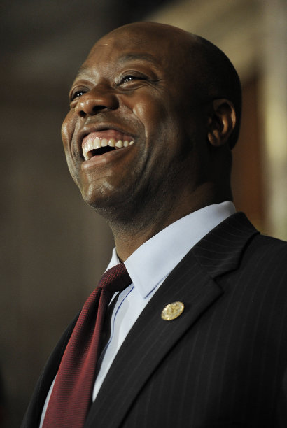 Unites States Rep. Tim Scott laughs during a press conference announcing him as U.S. Sen. Jim DeMint's replacement in the U.S. Senate at the South Carolina Statehouse on Monday, Dec. 17, 2012, in Columbia, S.C. South Carolina Gov. Nikki Haley picked U.S. Rep. Tim Scott to be the state's next U.S. senator Monday, making him the only black Republican in Congress and the South's first black Republican senator since Reconstruction. (AP Photo/Rainier Ehrhardt)
