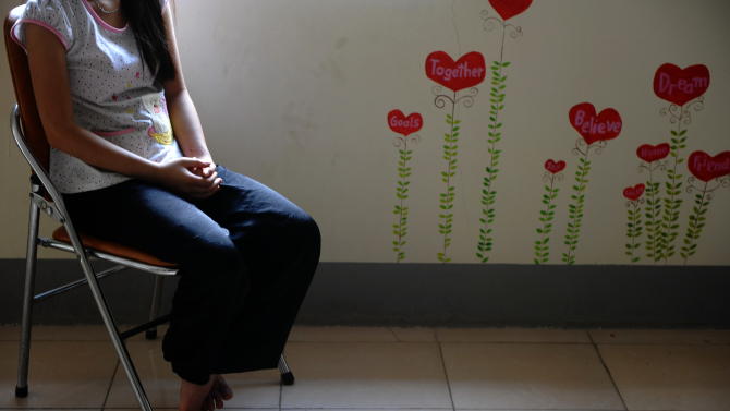 H&#39;mong ethnic teenager May Na (whose name has been changed to protect her identity) sits in the living room at a government-run centre for trafficked women in the northern Vietnamese city of Lao Cai, May 9, 2014