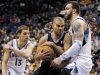 San Antonio Spurs guard Tony Parker, center, of France, drives around Minnesota Timberwolves center Nikola Pekovic, of Montenegro, right, and guard Luke Ridnour (13) during the first half of an NBA basketball game Wednesday, Feb. 6, 2013, in Minneapolis. (AP Photo/Genevieve Ross)