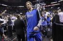 Dallas Mavericks' Dirk Nowitzki (41), of Germany, walks off the court after the team's loss to San Antonio Spurs in Game 7 of the opening-round NBA basketball playoff series, Sunday, May 4, 2014, in San Antonio. San Antonio won 119-96. (AP Photo/Eric Gay)