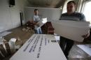 Members of a regional electoral commission prepare for the upcoming presidential election in Krasnoarmeisk