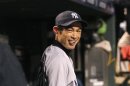 Yankees' Suzuki smiles in dugout before Game 1 of MLB ALDS playoff baseball series against Orioles in Baltimore