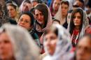 Assyrian Christians, who fled the unrest in Syria and Iraq, attend a mass with Lebanese Christians in Jdeideh, Lebanon on March 8, 2015