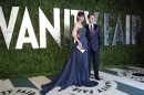 Actor Tom Cruise and his wife, actress Katie Holmes, arrive at the 2012 Vanity Fair Oscar party in West Hollywood