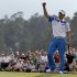 Amateur Guan Tianlang, of China, celebrates after a birdie putt on the 18th green during the first round of the Masters golf tournament Thursday, April 11, 2013, in Augusta, Ga. (AP Photo/Darron Cummings)