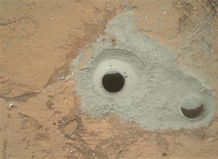 The hole in a rock called "John Klein" where the NASA's Curiosity rover conducted its first sample drilling on Mars