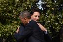 US President Barack Obama and Canada's Prime Minister Justin Trudeau hug during a welcome ceremony at the White House on March 10, 2016