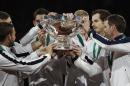 Team Britain holds the Davis Cup after Andy Murray, second right, defeated Belgium's David Goffin in three sets, 6-3, 7-5, 6-3, during their singles Davis Cup final tennis match at the Flanders Expo in Ghent, Belgium, Sunday, Nov. 29, 2015. (AP Photo/Alastair Grant)