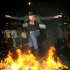 A San Francisco Giants fan jumps over a bonfire in San Francisco's Mission district Sunday, Oct. 28, 2012, after the Giants swept the Detroit Tigers to win baseball's World Series. (AP Photo/Noah Berger)