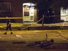 Police survey a crime scene following a shooting in Scarborough, a suburb in east Toronto