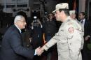 Egypt's interim President Mansour shake hands with Egypt's army chief Field Marshal Sisi after his meeting with members of the Supreme Council of the Armed Forces, in Cairo