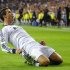 Real Madrid's Cristiano Ronaldo celebrates scoring the winning goal against Manchester City during their Champions League Group D soccer match at Santiago Bernabeu stadium in Madrid