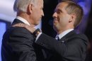 FILE - In this Aug. 27, 2008, file photo, then-Democratic vice presidential candidate Sen. Joe Biden, D-Del., left, embraces his son Beau on stage at the Democratic National Convention in Denver. A spokesman for the Delaware Department of Justice says Beau Biden, that state's attorney general, has been hospitalized after becoming weak and disoriented after a drive for a family vacation. Agency spokesman Jason Miller said late Monday that Biden, the vice president's son, is currently undergoing testing in Houston to investigate the cause of his symptoms. Vice President Biden accompanied his son to Houston. (AP Photo/Charles Dharapak, File)