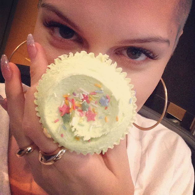 Celebs eating junk food: Jessie J poses with a pretty cupcake before polishing it off. Copyright [Jessie J]