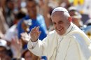 Pope Francis waves to faithful as he arrives for his weekly general audience in St. Peter's square at the Vatican, Wednesday, Sept. 4, 2013. (AP Photo/Riccardo De Luca)